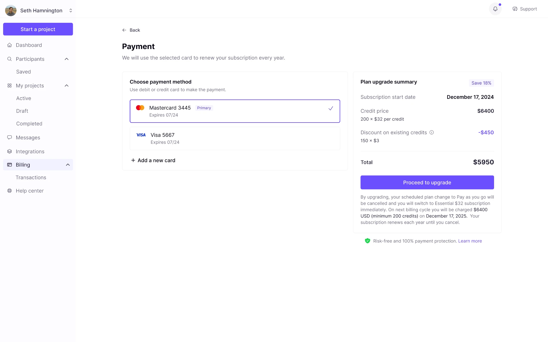 Payment screen where the customer selects a saved card as the payment method while reviewing the plan upgrade summary with credit price, existing-credit discount, and total